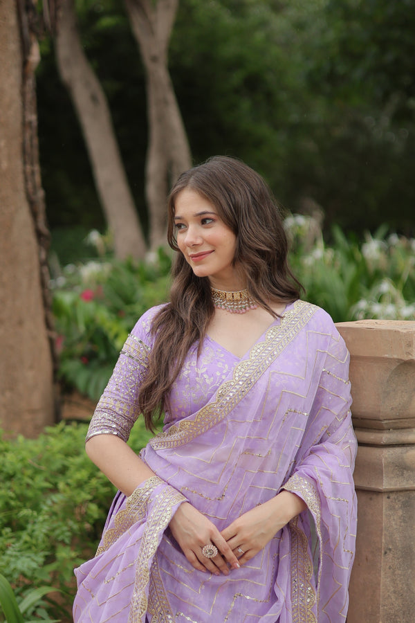 Introducing Lavender The Jequard Lehenga--Crafted On Delicate Viscose Dayble Jequard Fabric, Adorned With Intricate Sequins Embroidered Work, this ensemble is the Epitome of Elegance and Refinement. Elevate your style with a touch of sophistication..